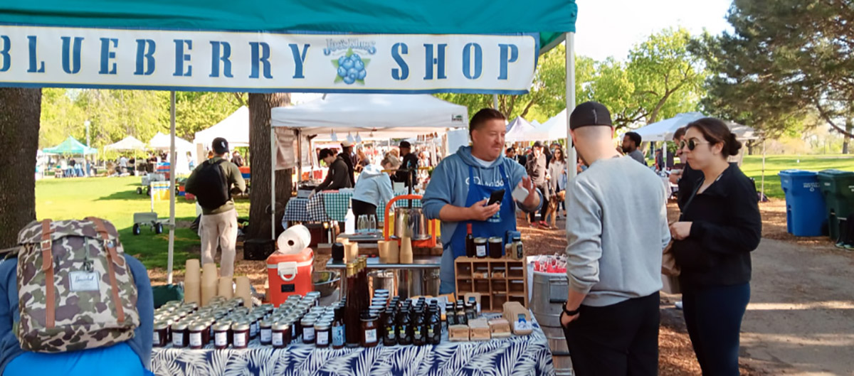 Andy at the market stand